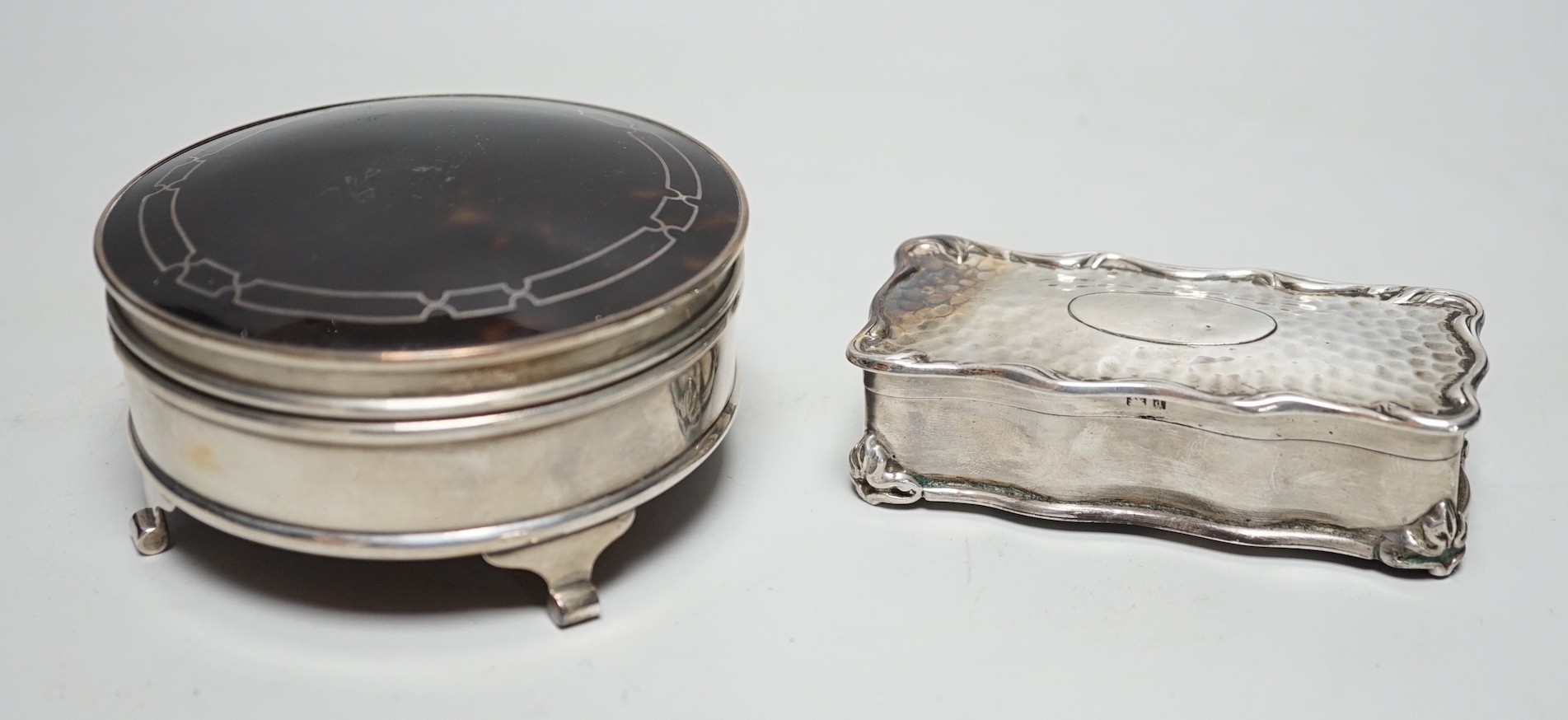 A George V silver and tortoiseshell mounted circular trinket box, Walker & Hall. Birmingham, 1918, 92mm and an earlier silver rectangular trinket box.